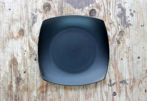 Empty plate in the wood Stock Photos