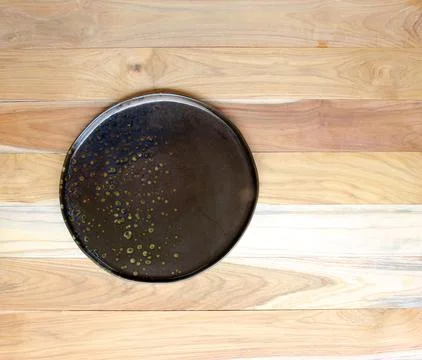 Empty plate on wooden table Stock Photos