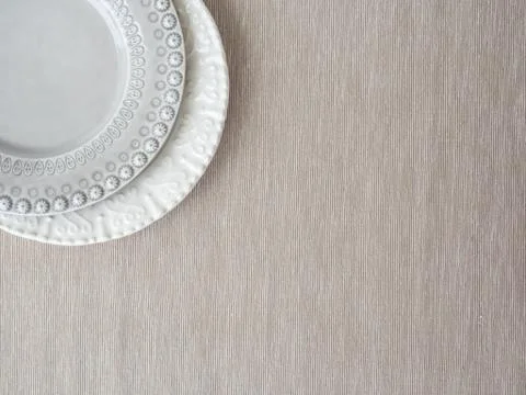 Empty plates on beige background Stock Photos