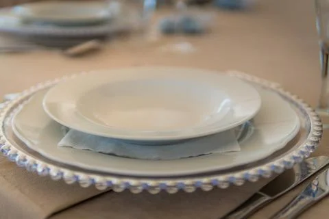 Empty Plates Set on a Table at a Wedding Reception Venue Stock Photos