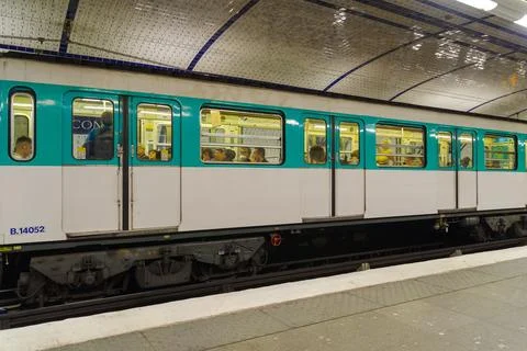 Empty platform and a subway train in Paris, France. Photos