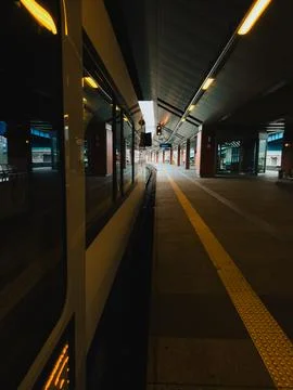 Empty platform at Central Station featuring modern train waiting under Foto stock