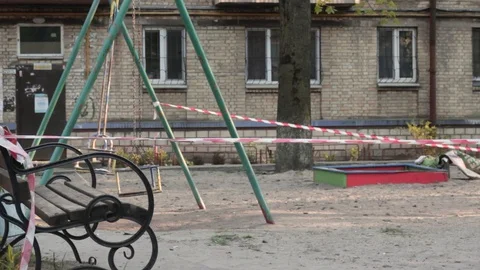Empty playground with bench and swing with no children Stock Footage 129240389