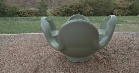 Empty playground carousel or roundabout spinning slowly by itself Stock-Footage 117280464