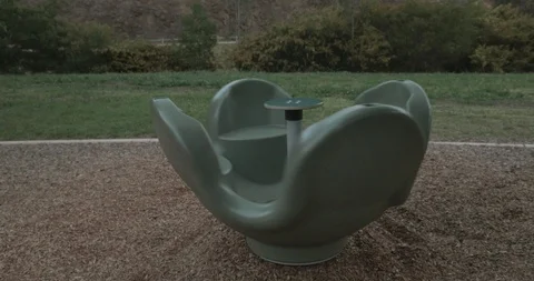 Empty playground carousel or roundabout spinning slowly by itself Stock-Footage 117280499