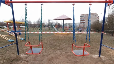 Empty playground fenced with protecrive tape Stock Footage 128808155
