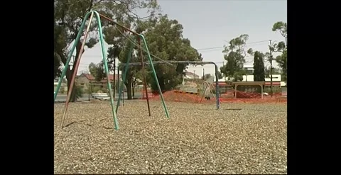 Empty Playground With Moving Swing Australia 1990s Stock Footage 318824077