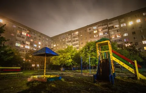 Empty playground in the night city. Stock Photos