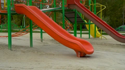 Empty playground in the park. Children's slides Stock Footage 139760763