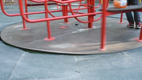 Empty playground with red carousel Stock Footage 134154224