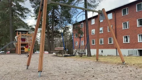 An empty playground with rocking swings Stock Footage 173038905