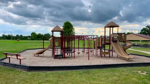 Empty Playground in the summer with storm clouds Stockbeeldmateriaal 155910034