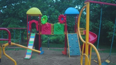 Empty playground with swing moving by itself Stock Footage 344483218