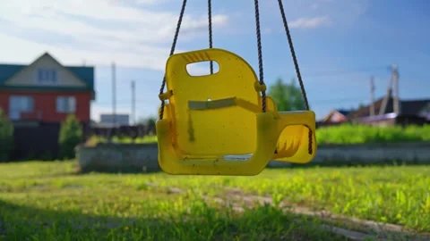 Empty Playground Swing Moving In Residential Neighborhood Stock Footage 337829708