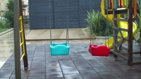 Empty Playground Swing Moving in Slow Motion Vidéo 145081348
