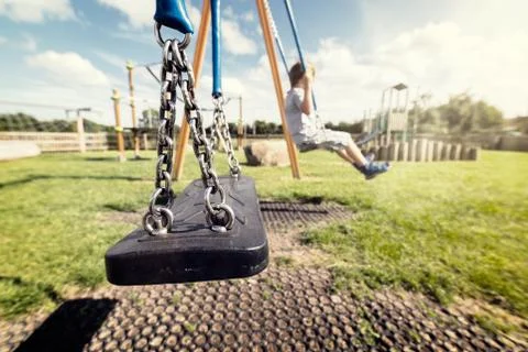 Empty playground swing Stock Photos