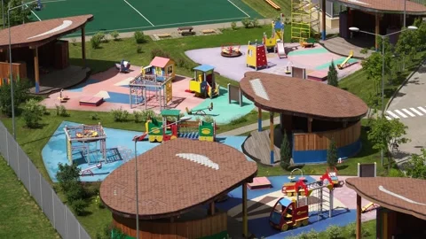 Empty playground with swings and carousel in sunny weather. Stock Footage 134730665