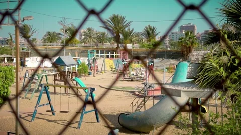 Empty Playground Through Chain-Link Fence Palm Trees Stock-Footage 313016282