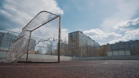 An empty Playground, the wind blows the net off the gate Stock Footage 128975040
