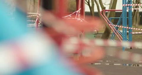 Empty playgrounds covered with a protective tape during quarantine of Stock Footage 128532255