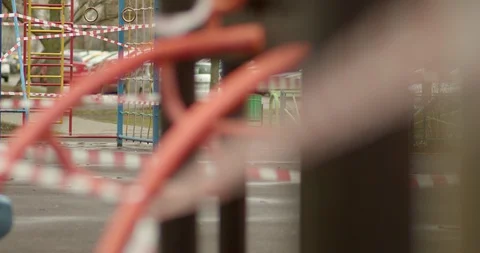 Empty playgrounds covered with a protective tape during quarantine of Stock Footage 128544785