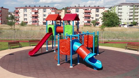 Empty playhouse and slide in a playground for kids. Deserted kindergarten park Stock Footage 156686526
