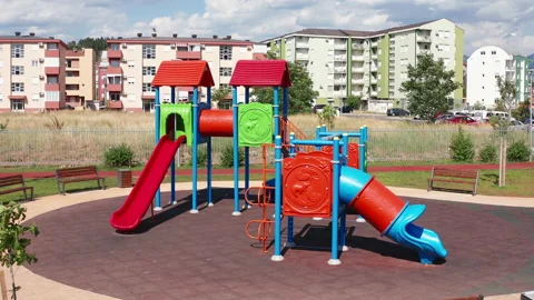 Empty playhouse and slide in a playground for kids. Deserted kindergarten park Stock Footage 156690195
