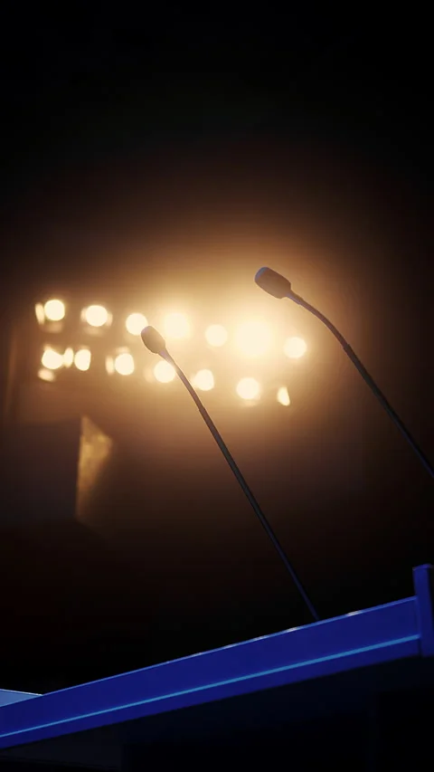 Empty Podium With Microphones on Conference Stage Under Spotlights Stock Footage 345558410