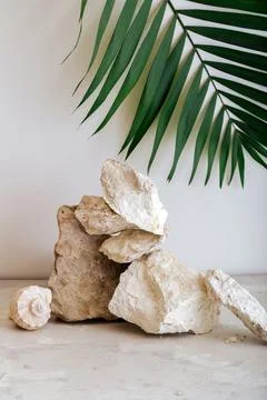 Empty Podium Stones tower. Gray stones pedestal display on beige background made Foto stock