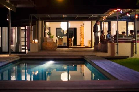 Empty pool in backyard of modern house Stock Photos
