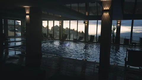 Empty pool reflecting in the water, luxury concept shot during sunset Stock Footage 263329067