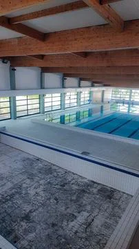 Empty Pool Renovation in a Public Pool. Sports Season Preparation Concept Stock Photos