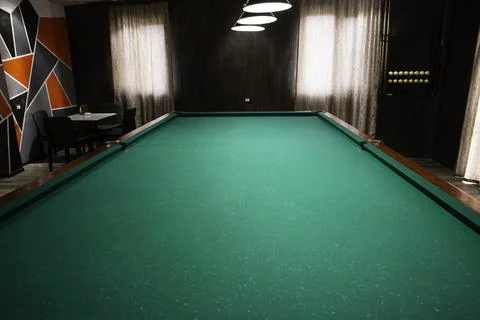 Empty pool table in billiard room Stock Photos