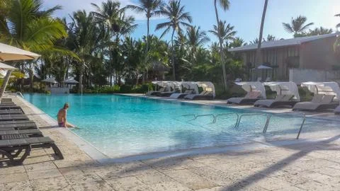 Empty poolside at tropical destination Stock Photos