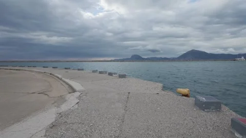 Empty Port Promenade Overlooking Open Sea Before Incoming Storm Stock Footage 338107730