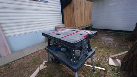 Empty portable workbench setup in garden for DIY home renovation. Stock Footage 341031692