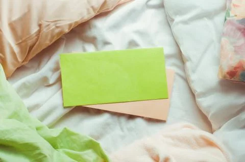 Empty postal envelopes on a bed Stock Photos