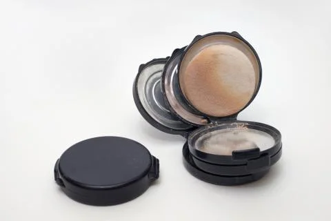 Empty powder boxes, closed black compact, dirty powder pad Stock Photos