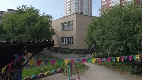 Empty preschool building with trees and playground Stock Footage 147252641