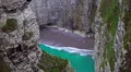 Empty private beach with azure water hidden between cliffs, paradise on earth HD Footage