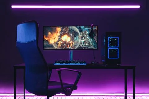 Empty pro gaming home studio in neon coloured room Stock Photos