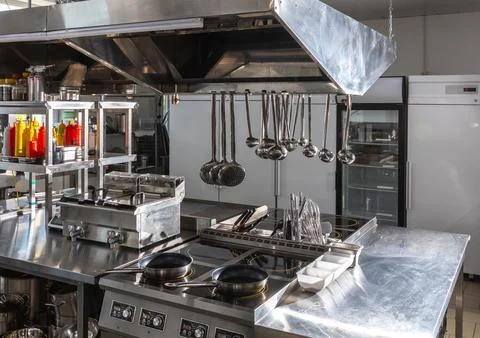 Empty Professional Kitchen in a Modern Restaurant. Concept of clean and ready-to Stock Photos