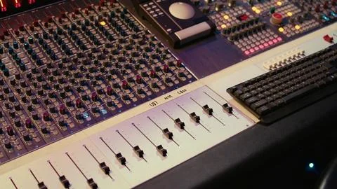 Empty professional studio with control desk mixer and pre amp knobs Stock Photos