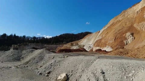 Empty quarry with excavated hill and brown rocks and minerals Stock Footage 154497113