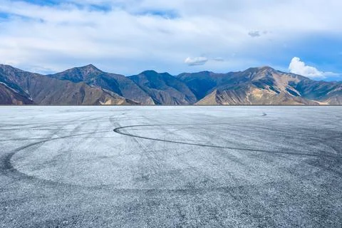 Empty race track and mountain with sky clouds landscape. Stock Photos