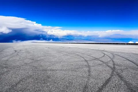 Empty race track and sky clouds landscape. Stock Photos