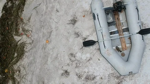 Empty Raft abandoned on a beach Stock Footage 98201825