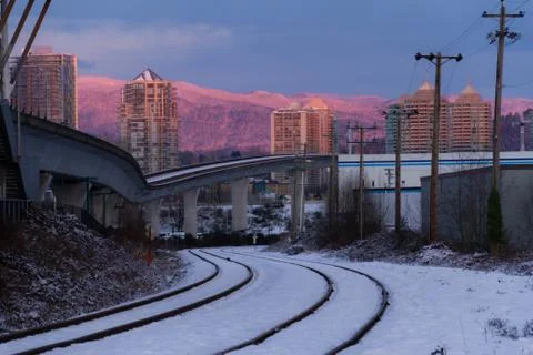 Empty rail in city while colorful sunset in winter Stock Photos
