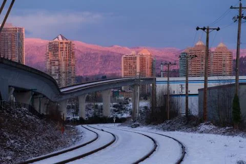 Empty rail in city while colorful sunset in winter Stock Photos