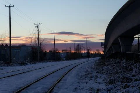 Empty rail in city while colorful sunset in winter Stock Photos